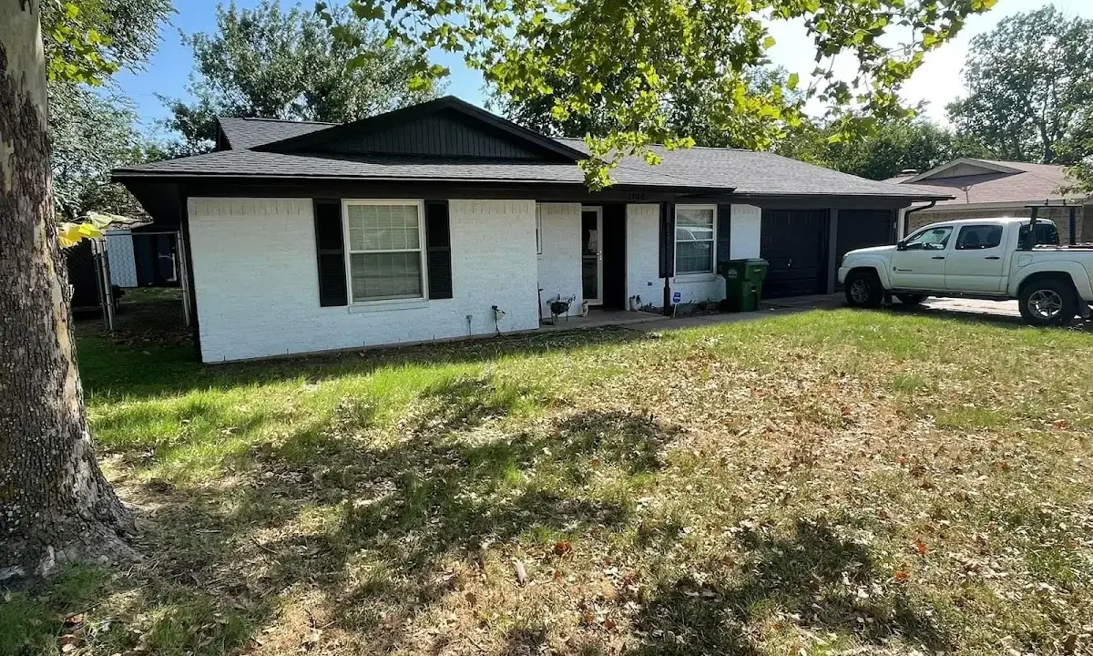 Professional roofing crew working on a residential roof in Bastrop