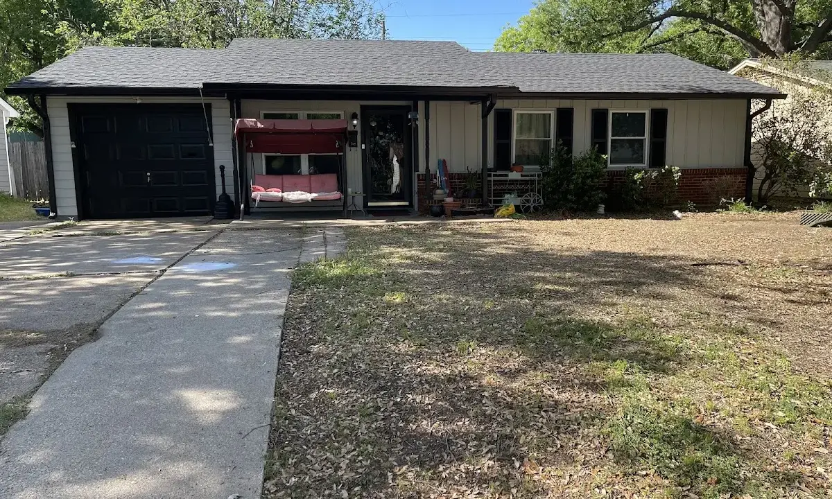 Hail Damage Roof Repair crew at work on a residential roof in Bastrop